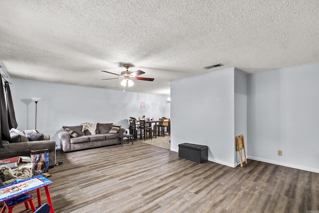 303 Pike Rd, Benton, AR 72019 - living room with wood finished floors, ceiling fan, a textured ceiling, and baseboards