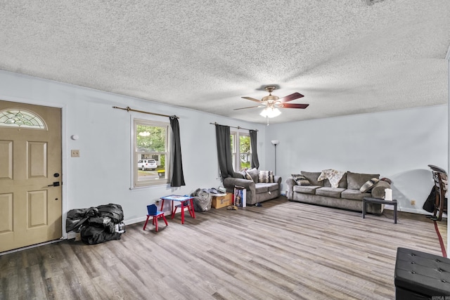 303 Pike Rd, Benton, AR 72019 - living room featuring ceiling fan, wood finished floors, a textured ceiling, and baseboards