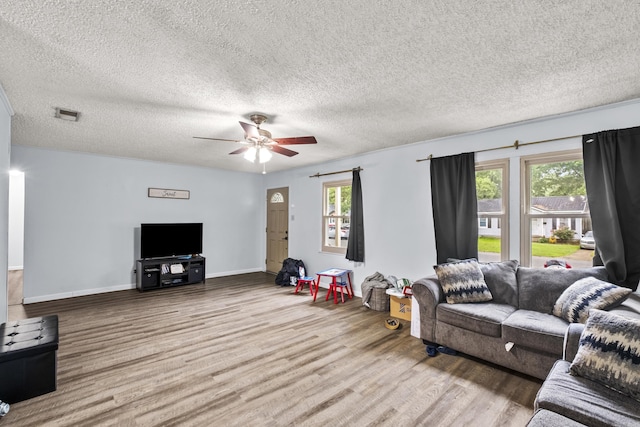 303 Pike Rd, Benton, AR 72019 - living area featuring wood finished floors, ceiling fan, a textured ceiling, and baseboards