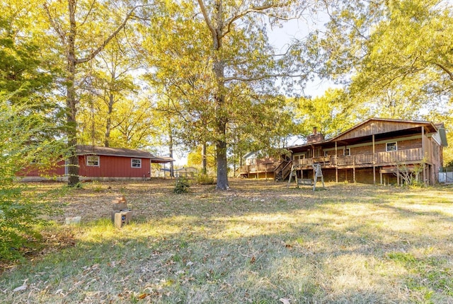 1257 Kimwood Dr, Benton, AR 72019 - view of grassy yard featuring a wooden deck and stairs