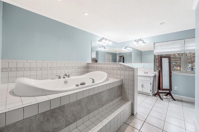 7713 Flintrock Rd, North Little Rock, AR 72116 - bathroom featuring tile patterned flooring, vanity, a bath, crown molding, and a textured ceiling