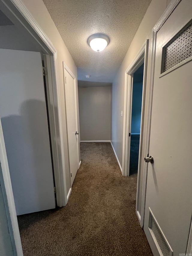 1206 E Twin Lakes Dr, Little Rock, AR 72204 - corridor with carpet, a textured ceiling, and baseboards