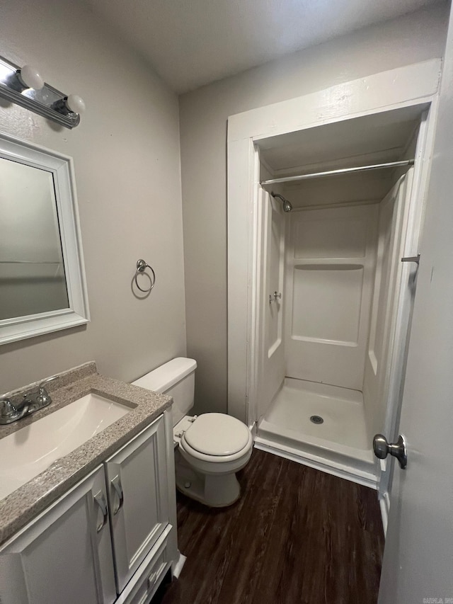 1206 E Twin Lakes Dr, Little Rock, AR 72204 - bathroom with wood finished floors, a shower stall, and vanity
