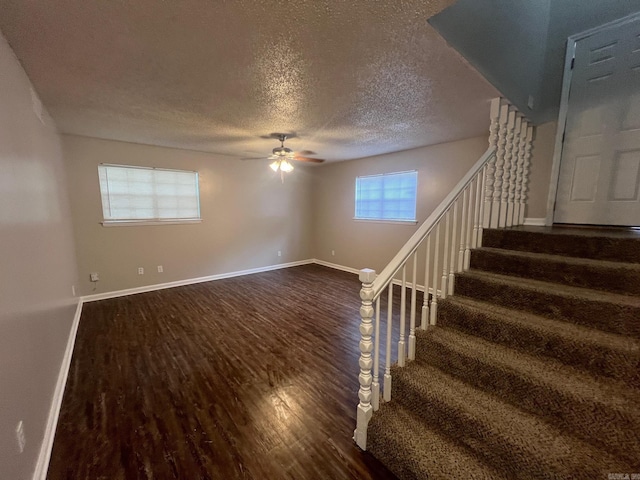 1206 E Twin Lakes Dr, Little Rock, AR 72204 - stairs with wood finished floors, a ceiling fan, a textured ceiling, and baseboards