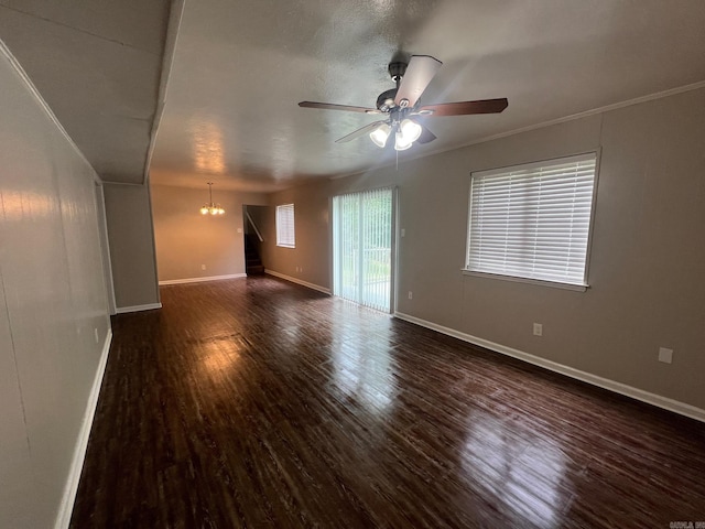 1206 E Twin Lakes Dr, Little Rock, AR 72204 - spare room featuring wood finished floors, ceiling fan, baseboards, and a chandelier