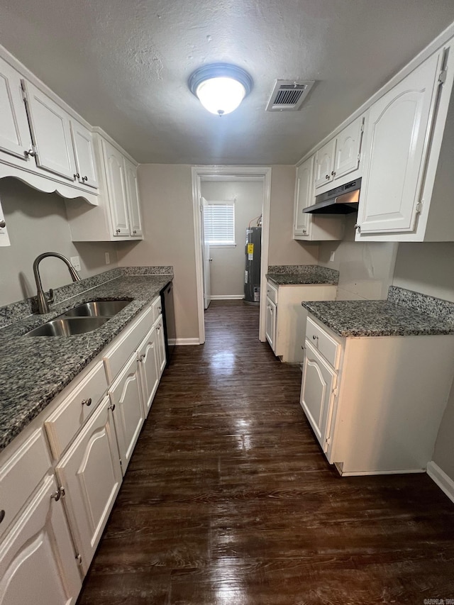 1206 E Twin Lakes Dr, Little Rock, AR 72204 - kitchen with a sink, under cabinet range hood, baseboards, white cabinets, and a textured ceiling