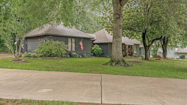 306 Cloverdale, Jonesboro, AR 72401 - view of front of property featuring roof with shingles, a front lawn, an attached garage, and concrete driveway
