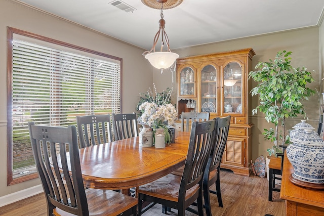 306 Cloverdale, Jonesboro, AR 72401 - dining room featuring wood finished floors, ornamental molding, and baseboards