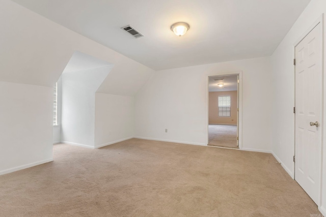 5 Briarstone Dr, Sherwood, AR 72120 - additional living space featuring light carpet, baseboards, and lofted ceiling