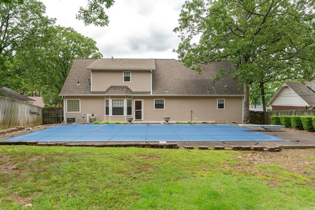 5 Briarstone Dr, Sherwood, AR 72120 - back of property with a shingled roof and a patio area