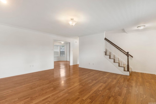 5 Briarstone Dr, Sherwood, AR 72120 - unfurnished room featuring stairs, wood finished floors, and ornamental molding
