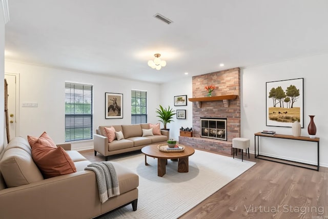 5 Briarstone Dr, Sherwood, AR 72120 - living room with wood finished floors, a fireplace, recessed lighting, and baseboards