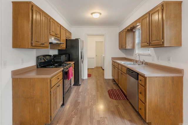 5 Briarstone Dr, Sherwood, AR 72120 - kitchen with gas stove, dishwasher, a sink, under cabinet range hood, and light wood finished floors