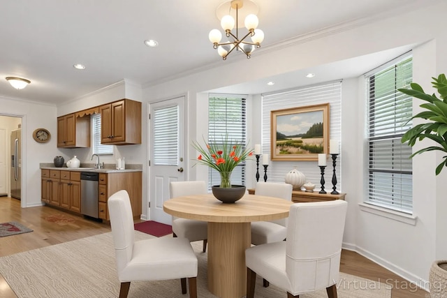 5 Briarstone Dr, Sherwood, AR 72120 - dining area with ornamental molding, a chandelier, light wood-style flooring, recessed lighting, and baseboards