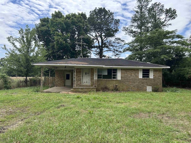 10613 Mitchell Rd, Jacksonville, AR 72076 - ranch-style home featuring brick siding and a front yard