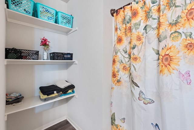 35 Summer Breeze Rd, Conway, AR 72032 - bathroom featuring baseboards, wood finished floors, and a shower with shower curtain