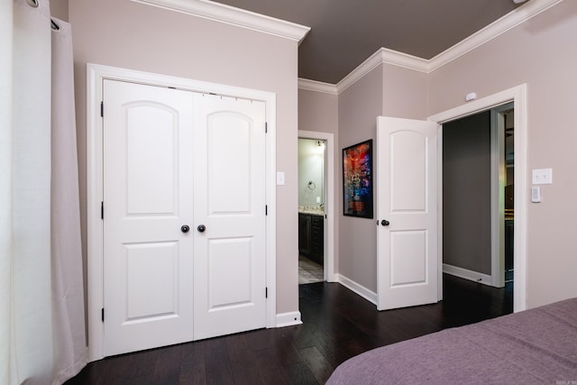 14 Cypress Valley Ct, Maumelle, AR 72113 - bedroom featuring crown molding, dark wood-style floors, baseboards, a closet, and ensuite bathroom