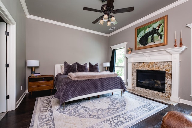 14 Cypress Valley Ct, Maumelle, AR 72113 - bedroom featuring dark wood finished floors, ornamental molding, baseboards, a premium fireplace, and ceiling fan