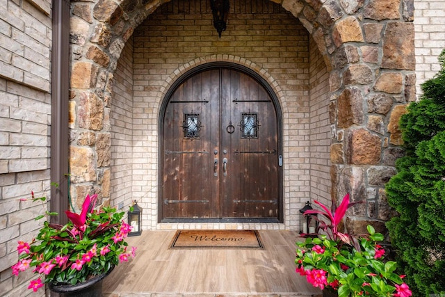 14 Cypress Valley Ct, Maumelle, AR 72113 - property entrance featuring brick siding and stone siding