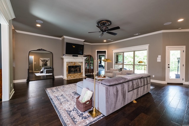 14 Cypress Valley Ct, Maumelle, AR 72113 - living area with a ceiling fan, a premium fireplace, arched walkways, dark wood-style flooring, and recessed lighting