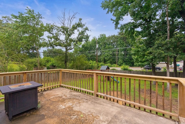 6209 Navajo Trl, North Little Rock, AR 72116 - view of patio featuring a playground and an outdoor fire pit