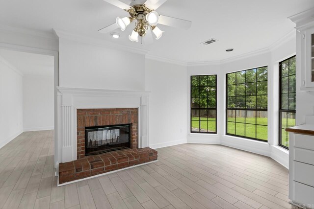 1208 Hilltop Rd, Alexander, AR 72022 - unfurnished living room with a ceiling fan, a brick fireplace, ornamental molding, baseboards, and wood finished floors