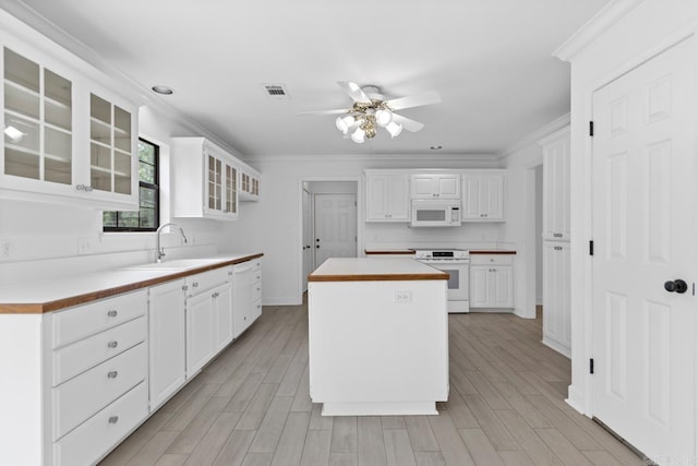 1208 Hilltop Rd, Alexander, AR 72022 - kitchen featuring white appliances, a sink, a ceiling fan, glass insert cabinets, and white cabinetry