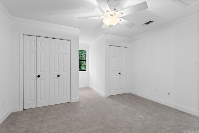 1208 Hilltop Rd, Alexander, AR 72022 - unfurnished bedroom featuring carpet floors, crown molding, baseboards, multiple closets, and ceiling fan