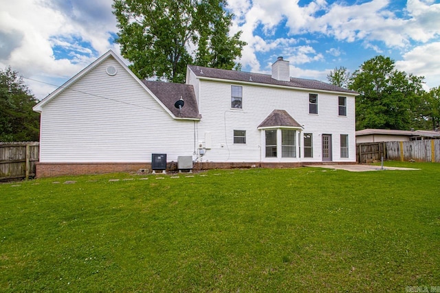 1208 Hilltop Rd, Alexander, AR 72022 - back of house featuring a chimney, a patio, central air condition unit, and a shingled roof