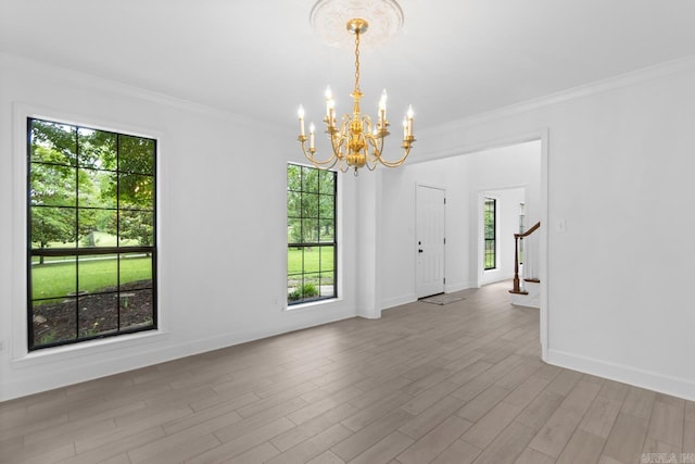 1208 Hilltop Rd, Alexander, AR 72022 - empty room featuring a chandelier, ornamental molding, baseboards, wood finished floors, and stairs