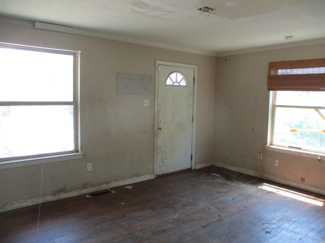 1001 Park St, North Little Rock, AR 72114 - foyer entrance with wood finished floors, crown molding, and baseboards