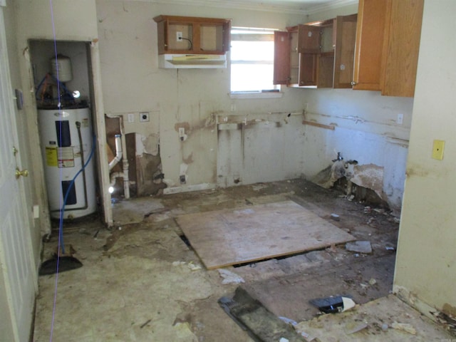 1001 Park St, North Little Rock, AR 72114 - kitchen featuring water heater, brown cabinetry, and open shelves