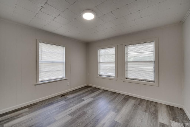 208 King Rd, Benton, AR 72019 - spare room featuring wood finished floors, crown molding, and baseboards