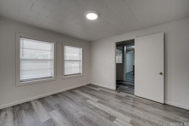 208 King Rd, Benton, AR 72019 - unfurnished room featuring light wood-style flooring, baseboards, and crown molding