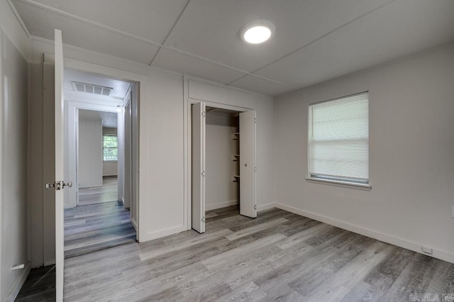 208 King Rd, Benton, AR 72019 - unfurnished bedroom featuring light wood finished floors, baseboards, and a closet