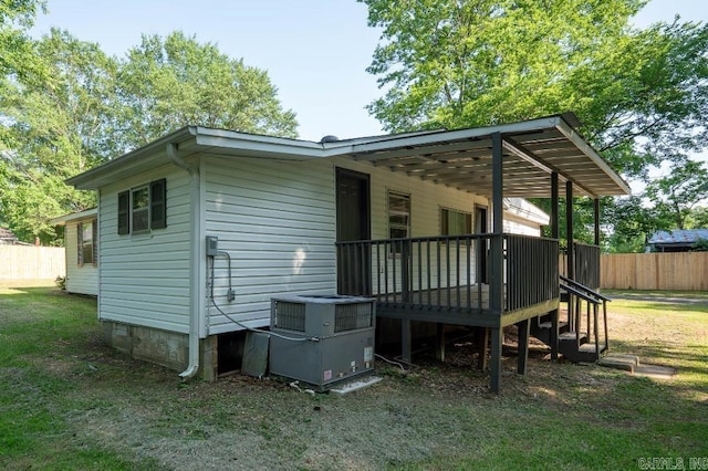 208 King Rd, Benton, AR 72019 - rear view of property featuring central air condition unit and a wooden deck