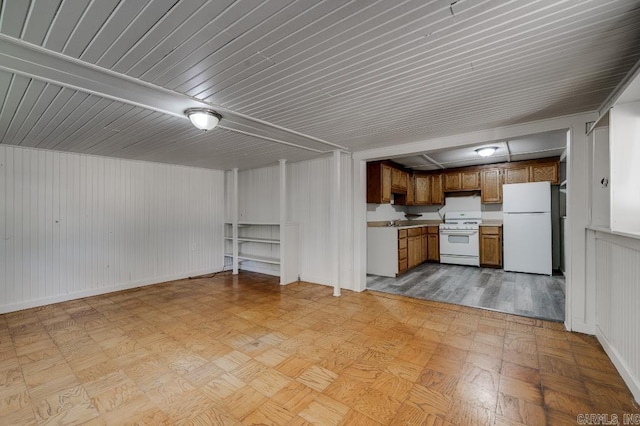 208 King Rd, Benton, AR 72019 - kitchen with white appliances, brown cabinets, light countertops, a sink, and baseboards