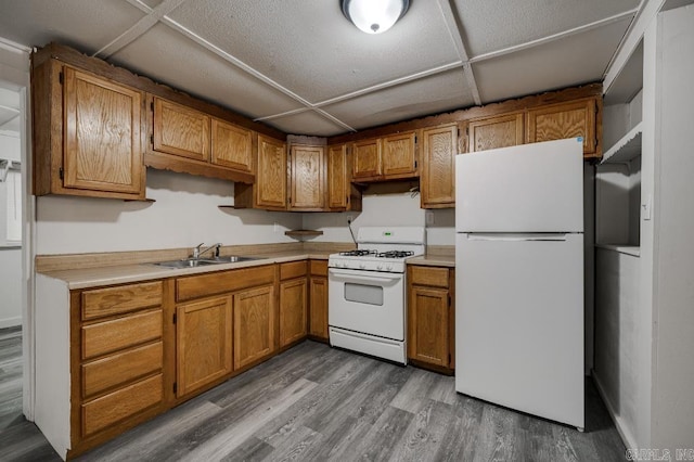 208 King Rd, Benton, AR 72019 - kitchen with white appliances, a sink, brown cabinets, and wood finished floors
