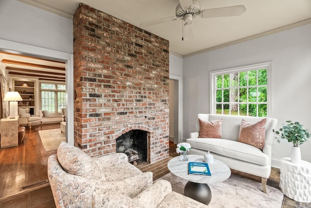489 Ridgeway Dr, Little Rock, AR 72205 - living area featuring ornamental molding, a brick fireplace, ceiling fan, and wood finished floors