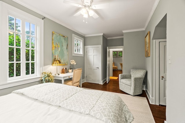 489 Ridgeway Dr, Little Rock, AR 72205 - bedroom with dark wood-style flooring, multiple windows, baseboards, ornamental molding, and a ceiling fan