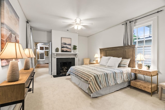 489 Ridgeway Dr, Little Rock, AR 72205 - carpeted bedroom featuring a fireplace with flush hearth and ceiling fan