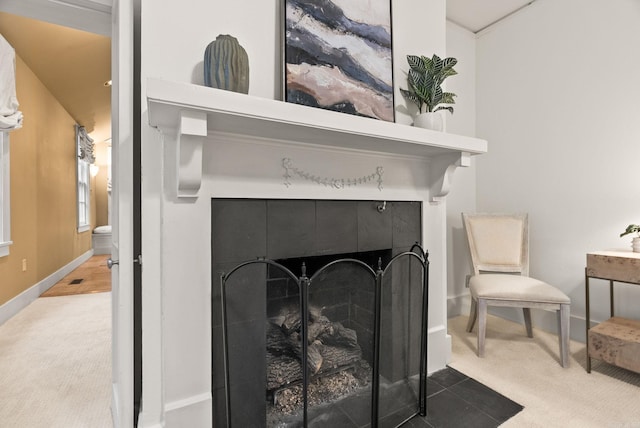 489 Ridgeway Dr, Little Rock, AR 72205 - detailed view of carpet floors, baseboards, and a tile fireplace