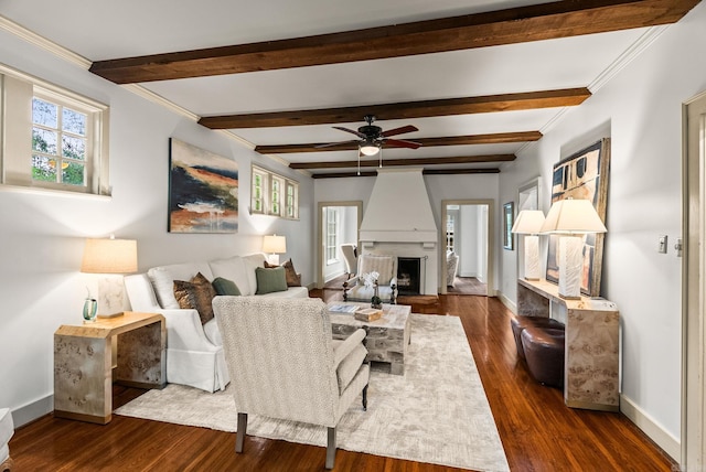 489 Ridgeway Dr, Little Rock, AR 72205 - living room with baseboards, dark wood-style flooring, a large fireplace, a ceiling fan, and beamed ceiling