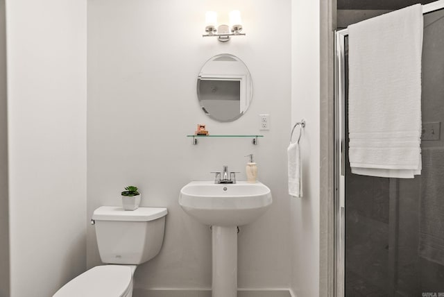 489 Ridgeway Dr, Little Rock, AR 72205 - bathroom featuring toilet and baseboards