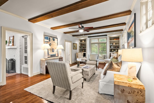489 Ridgeway Dr, Little Rock, AR 72205 - living room featuring wood finished floors, baseboards, ceiling fan, a fireplace, and beam ceiling