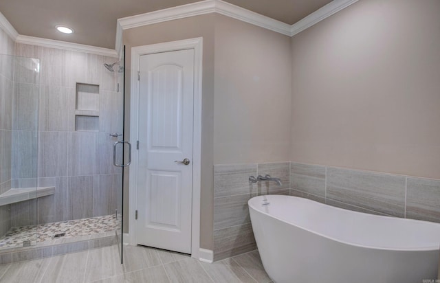 69 Lucia Ln, Maumelle, AR 72113 - bathroom with a stall shower, a freestanding tub, tile patterned flooring, recessed lighting, and ornamental molding