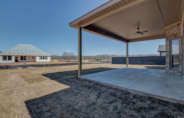 69 Lucia Ln, Maumelle, AR 72113 - fenced backyard featuring a ceiling fan and a patio