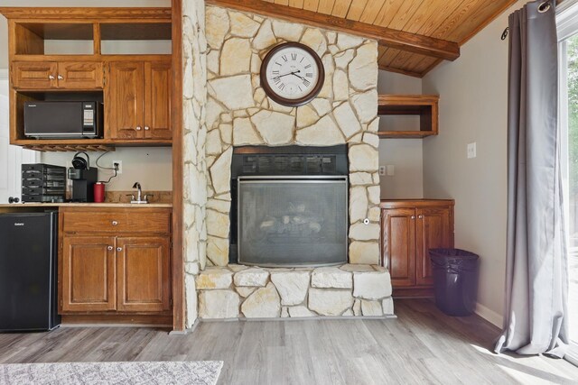 11 Crystal Mountain Ln, Maumelle, AR 72113 - kitchen featuring black appliances, wood ceiling, light wood-style flooring, open shelves, and brown cabinets