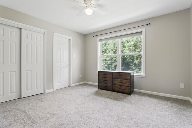 11 Crystal Mountain Ln, Maumelle, AR 72113 - unfurnished bedroom with carpet flooring, baseboards, a closet, and a ceiling fan