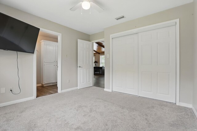 11 Crystal Mountain Ln, Maumelle, AR 72113 - unfurnished bedroom featuring carpet flooring, baseboards, a closet, and a ceiling fan